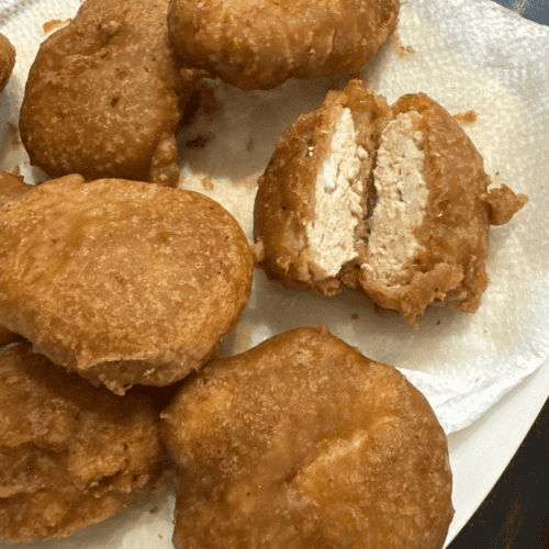 Delicious golden fried chicken nuggets perfect for family meals and snacks.