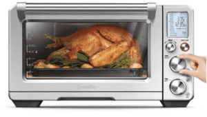 Healthy roasted chicken in a modern toaster oven for a delicious meal.