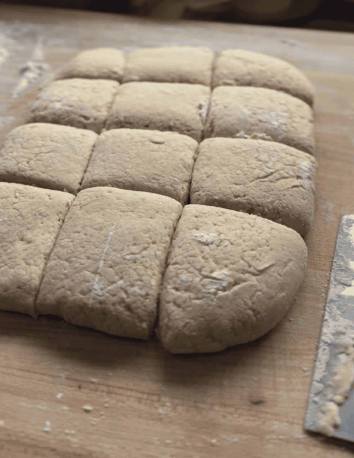 gluten free beignet dough proofing on a wooden countertop