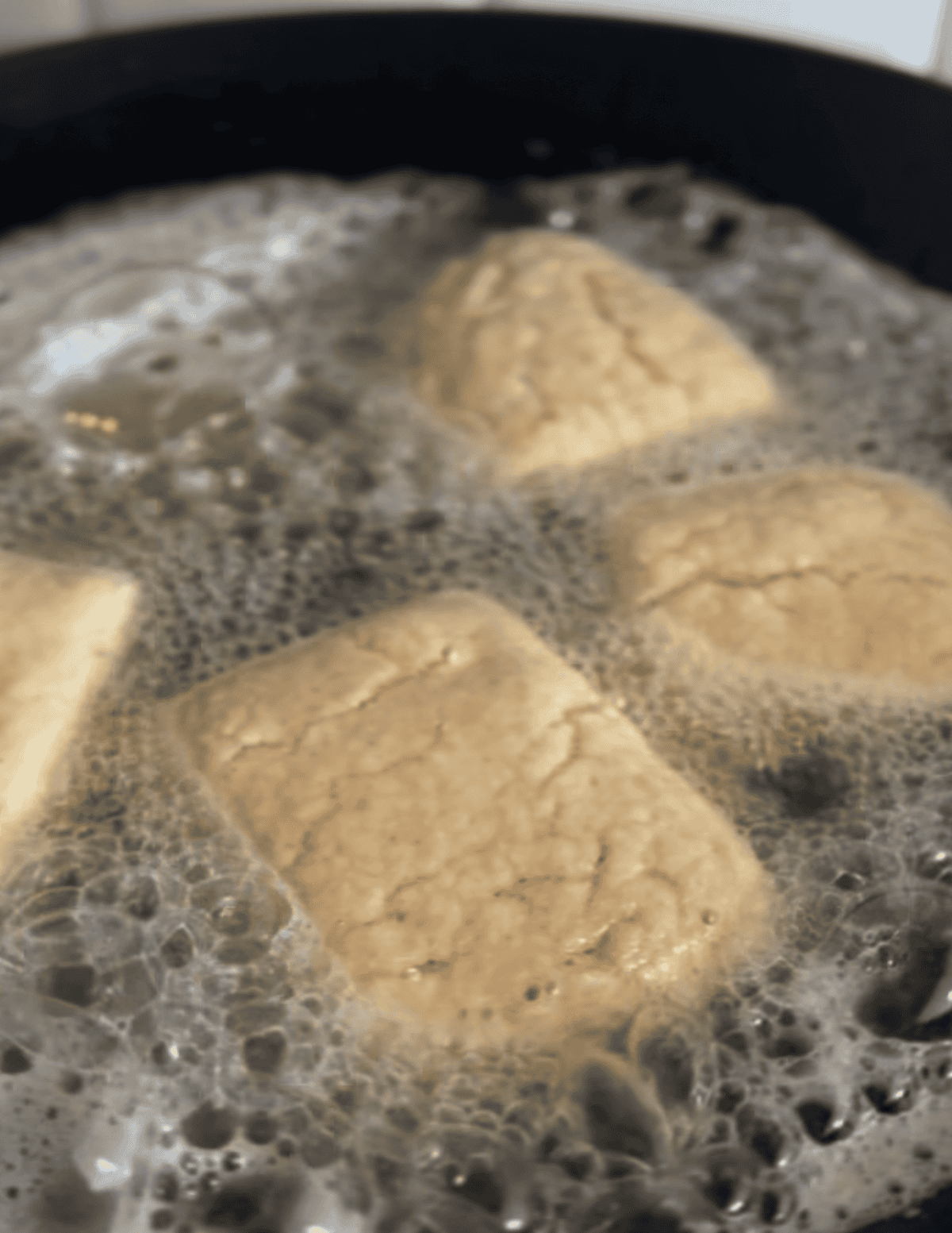 gluten free beignet dough frying in tallow