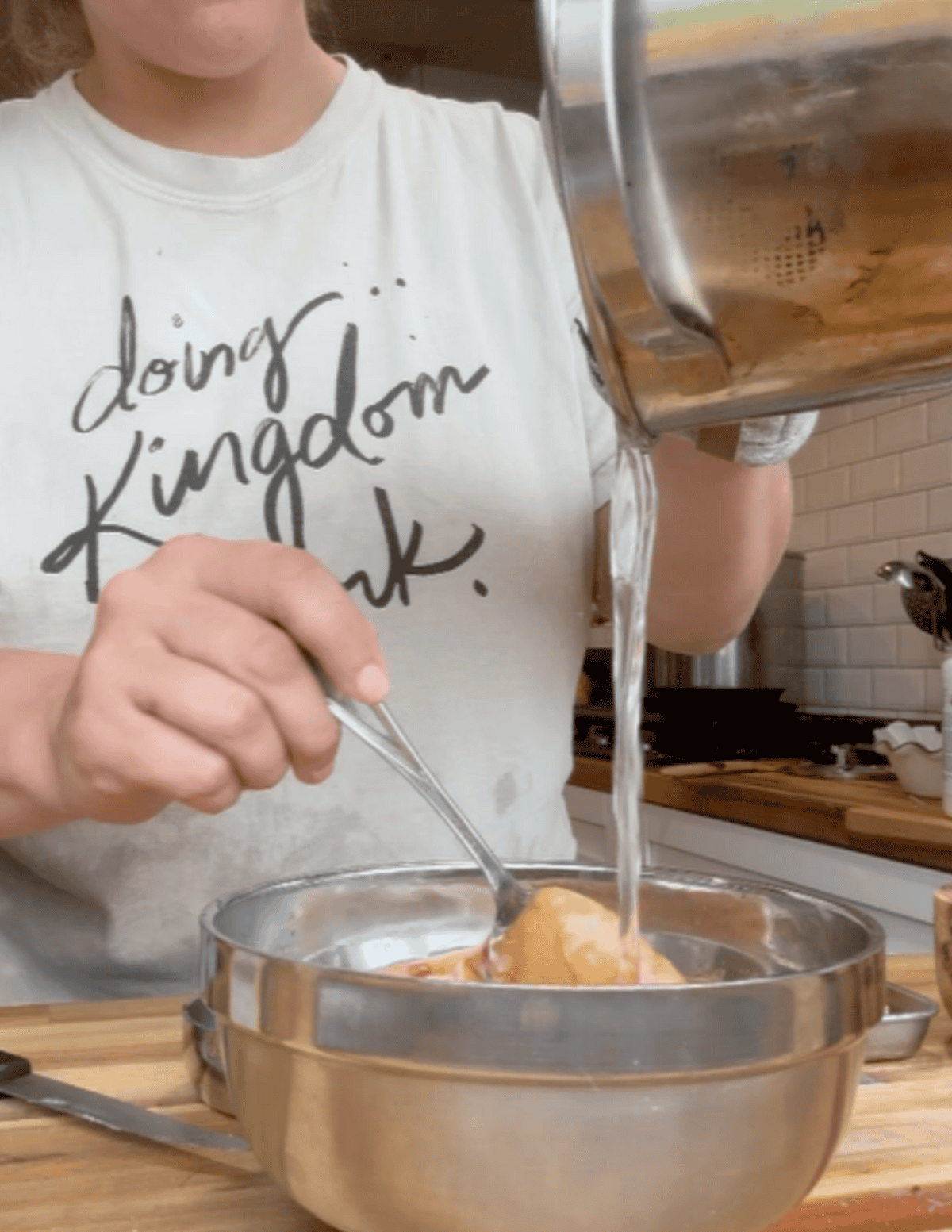 Triple layer dessert cake coconut being poured into peanut butter
