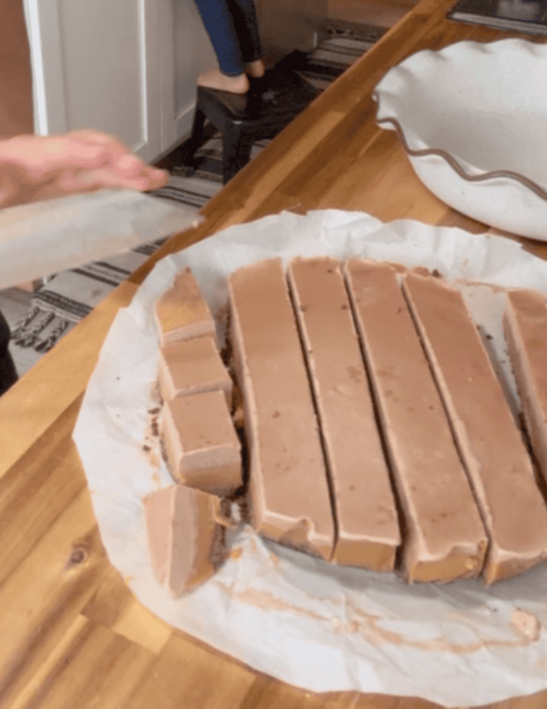 Triple layer dessert cake slices on the counter.