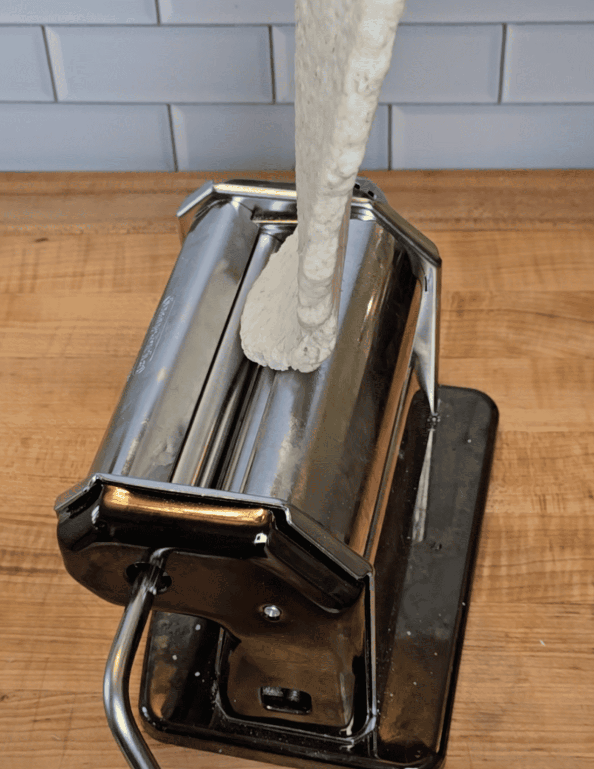 pasta roller used for thinning out gluten free dumpling dough