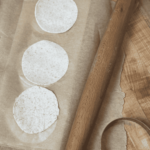 gluten free wonton wrappers lined on parchment paper