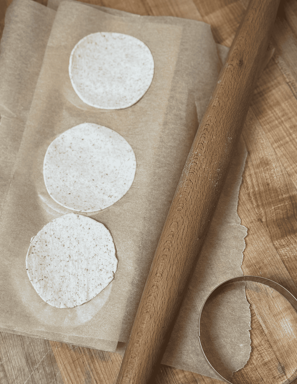 gluten free wonton wrappers lined on parchment paper