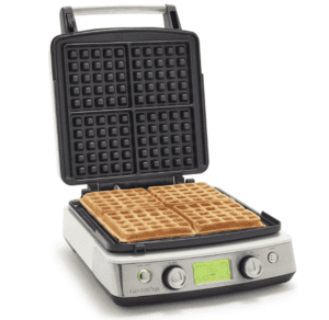 Greenspan waffle maker with black, non-stick plates and four cooked waffles.