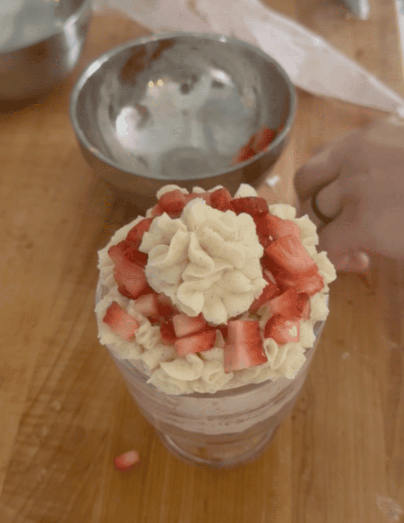 Strawberry ice cream nachos with whipped cream and fresh strawberries.