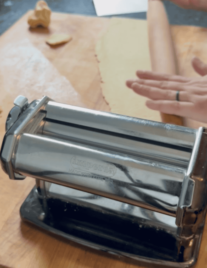 Gluten free wonton wrapper dough rolling thin to prepare for shaping