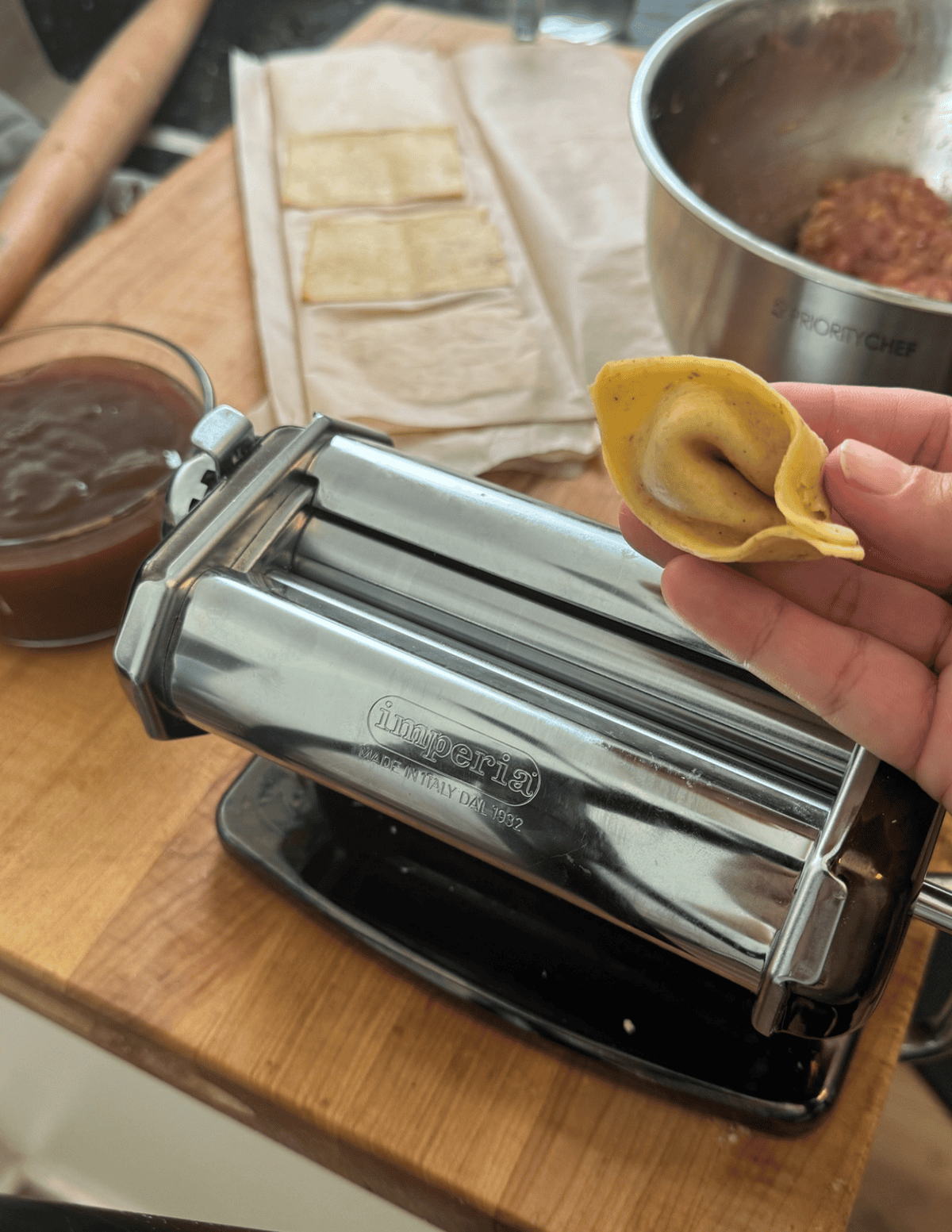gluten free wonton wrapper prepared for a fried wonton with the roller and wrapper in the background