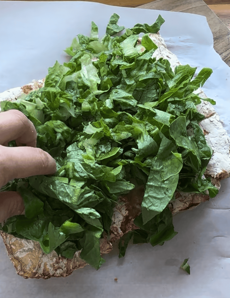 cooked chicken patty covers in lettuce