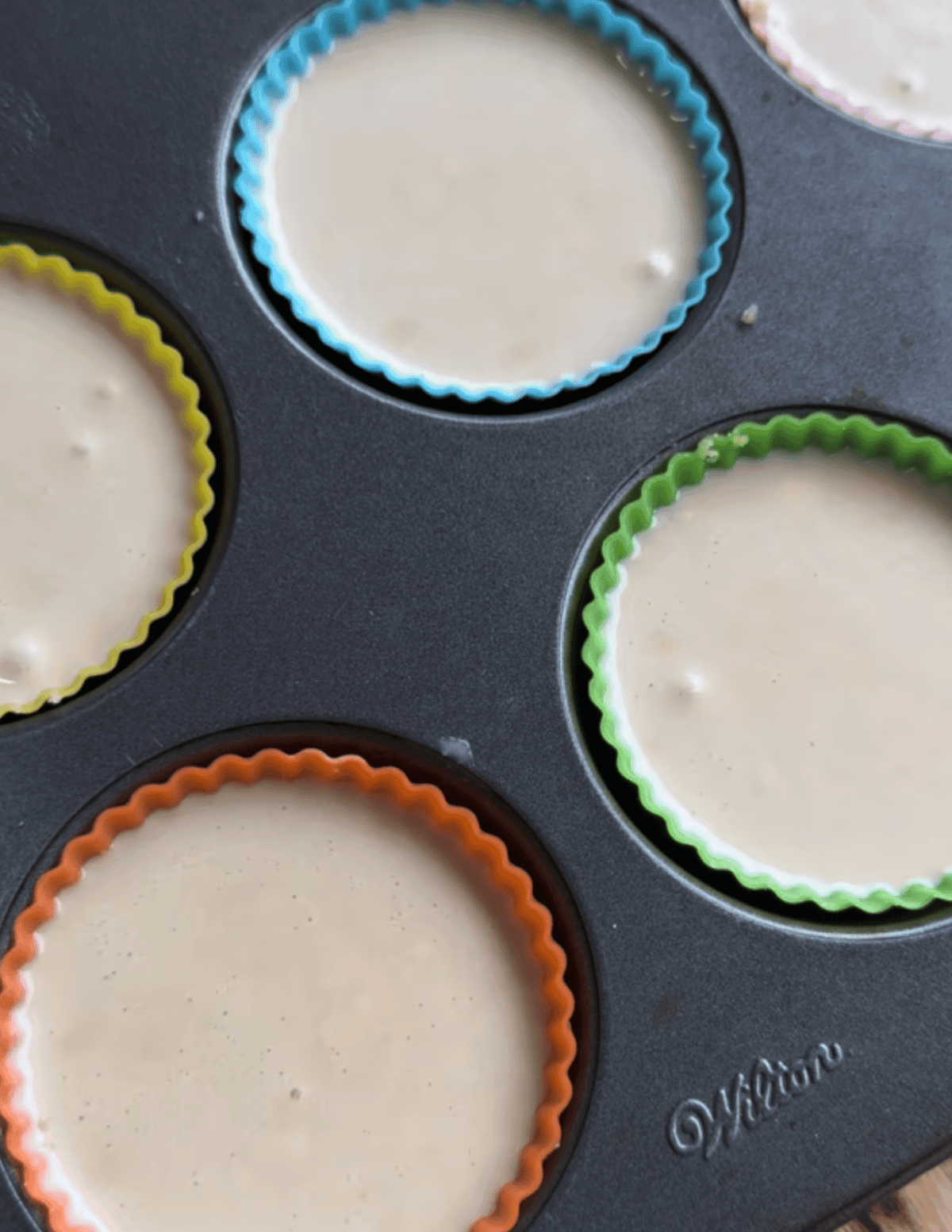 gluten free raspberry cheesecake bites being prepared with cheesecake layer