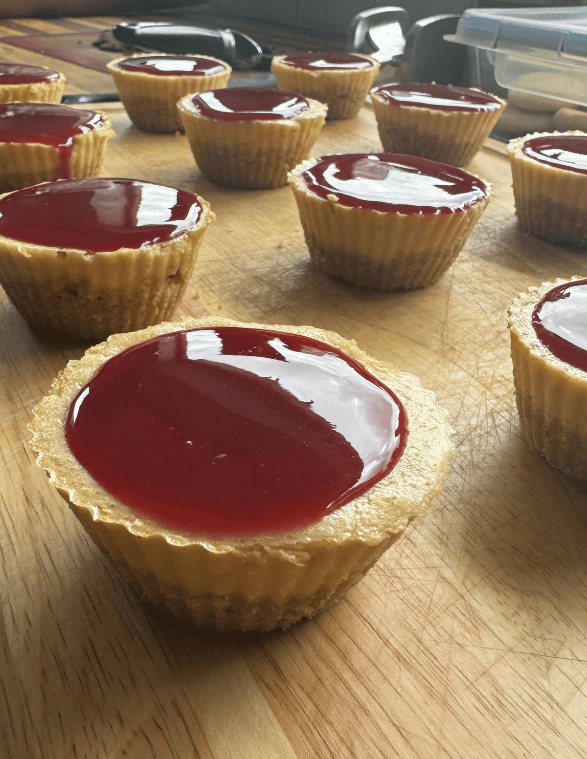 gluten free raspberry cheesecake bites with raspberry compote on top
