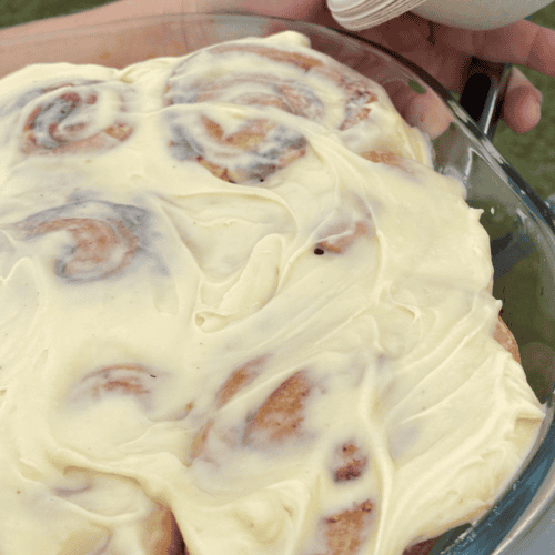 Cinnamon rolls coated in cream cheese icing
