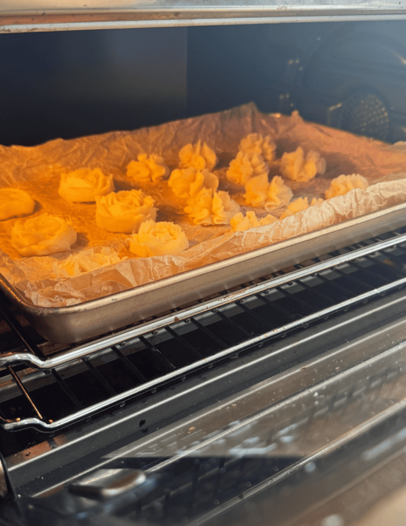 Freshly baked pastries cooling on a tray in the oven at Farm Fresh Family.