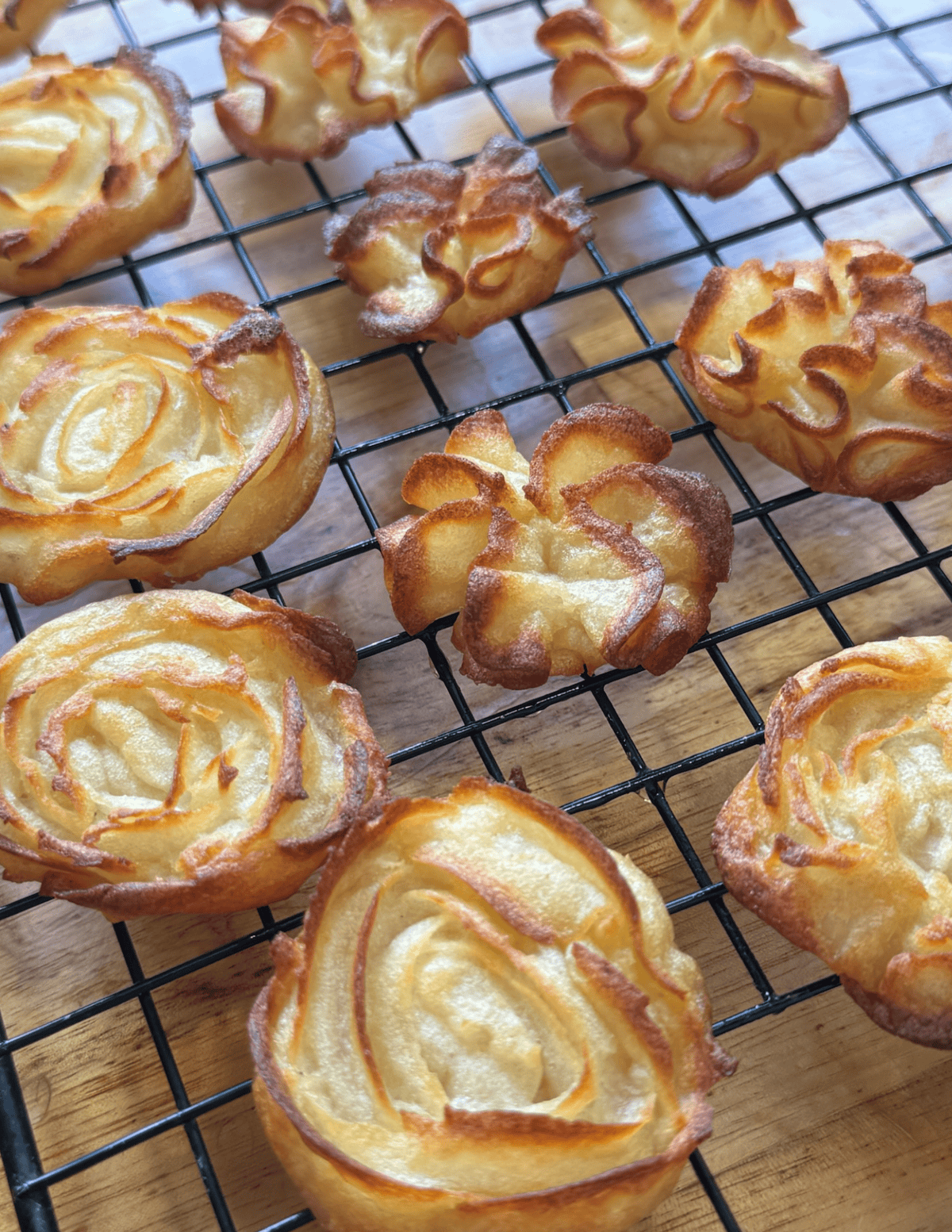 Delicious homemade pastries cooling on a wire rack, showcasing farm-fresh ingredients and baking exp.