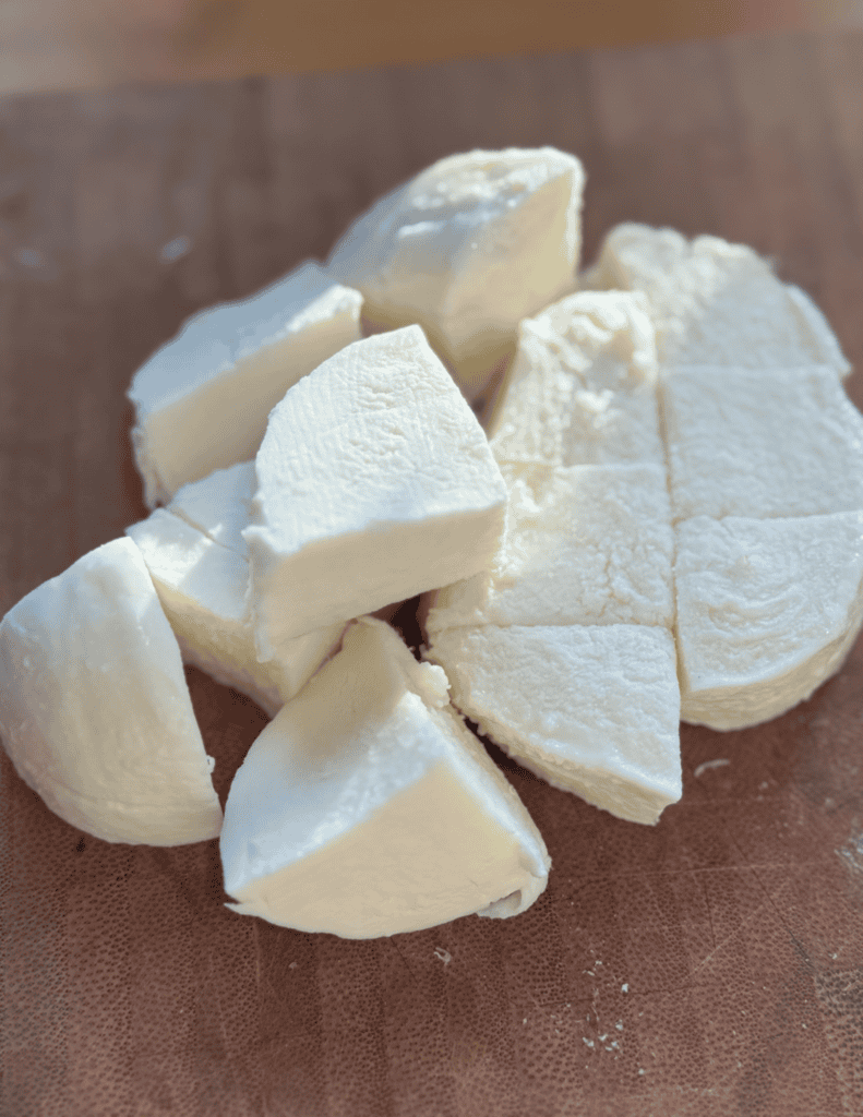 Cheese from farm-fresh milk, cut into chunks for cooking or snacking.