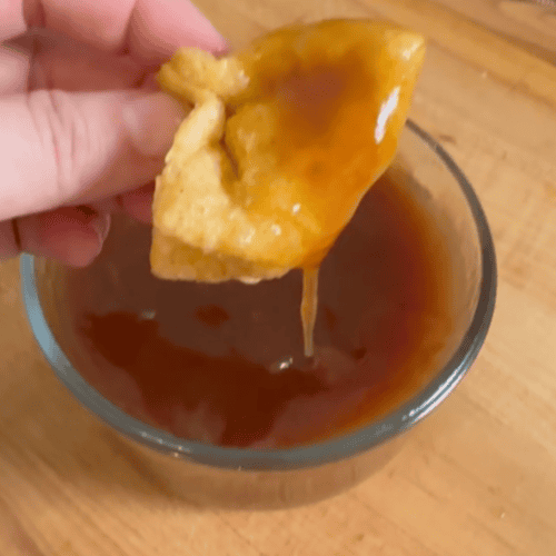crab rangoon dipped in sweet and sour sauce