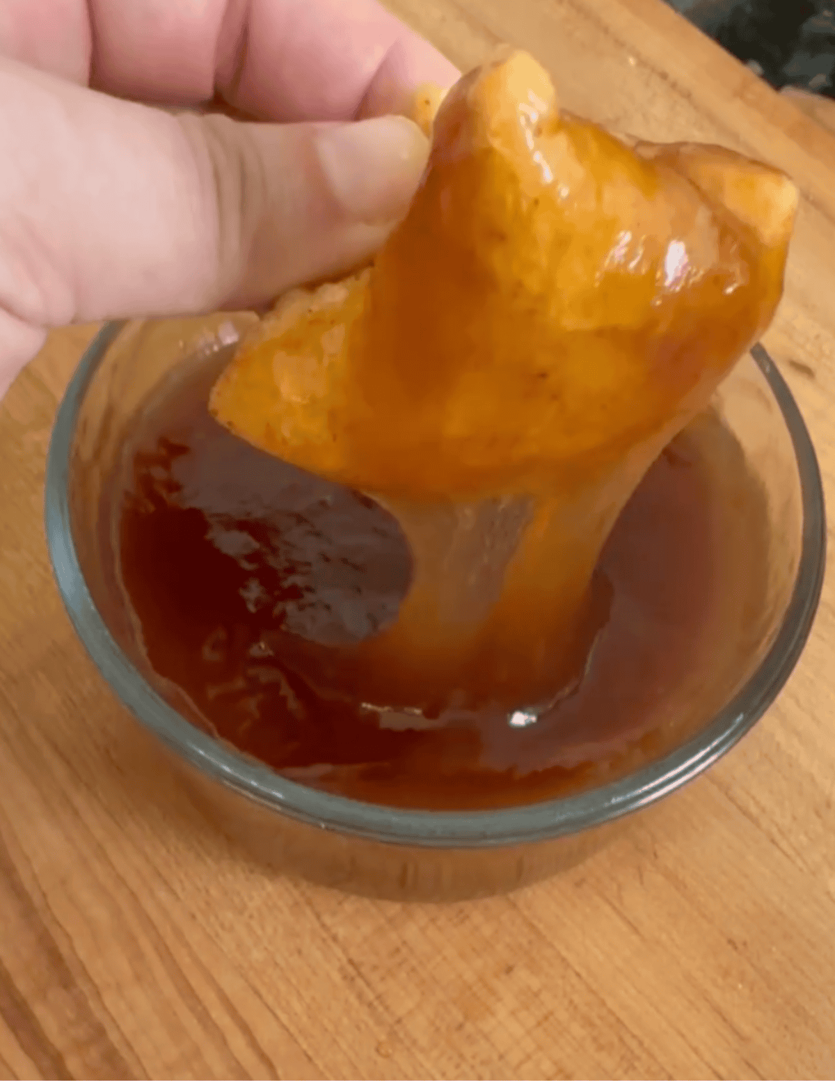 gluten free crab rangoon dipped in sweet and sour sauce