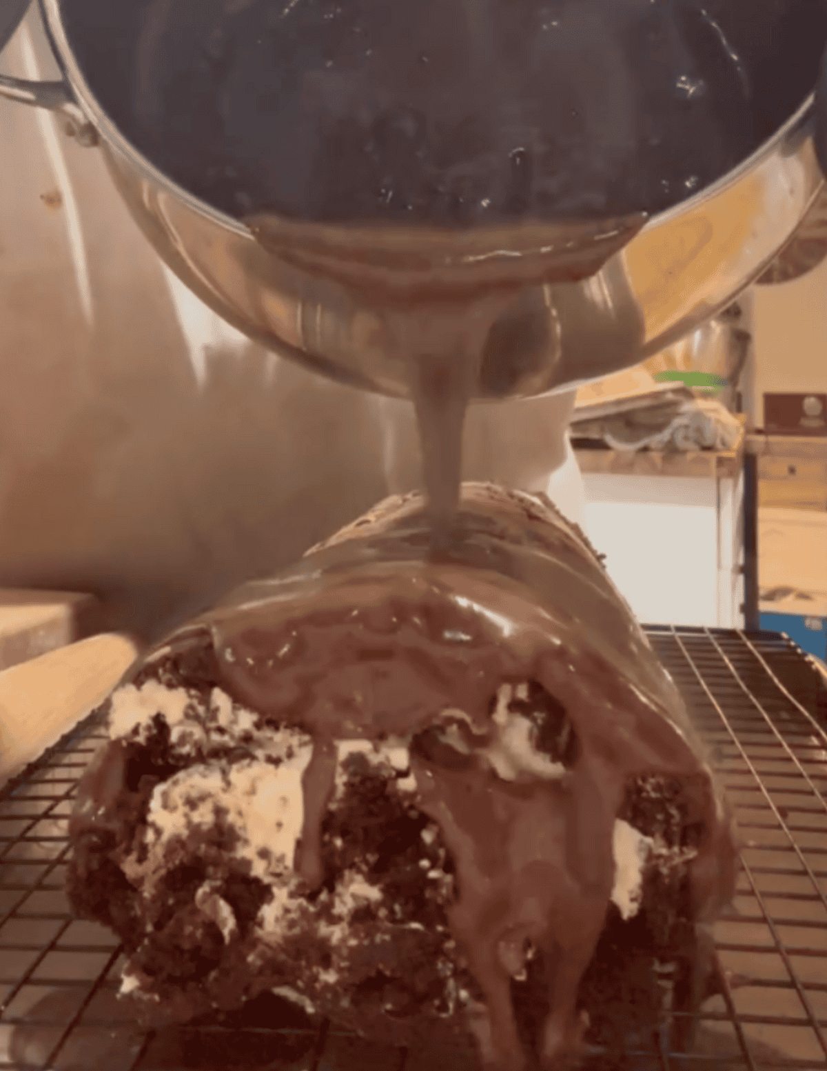 Pouring rich chocolate ganache over homemade chocolate cake at Farm Fresh Family.