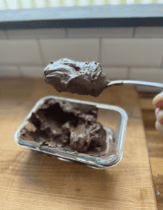 Delicious homemade chocolate spread on a spoon, ready to enjoy.