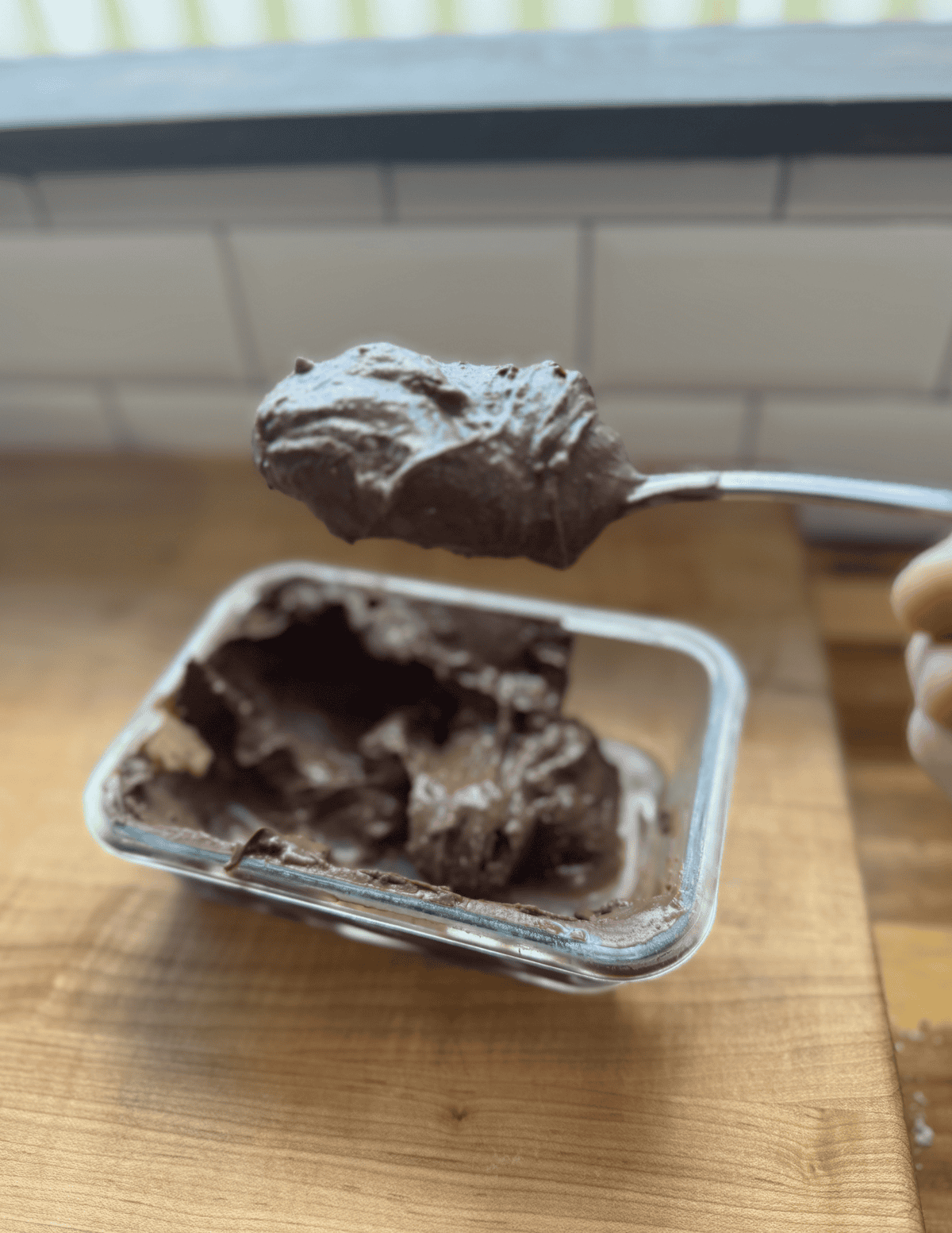 Delicious homemade chocolate spread on a spoon, ready to enjoy.
