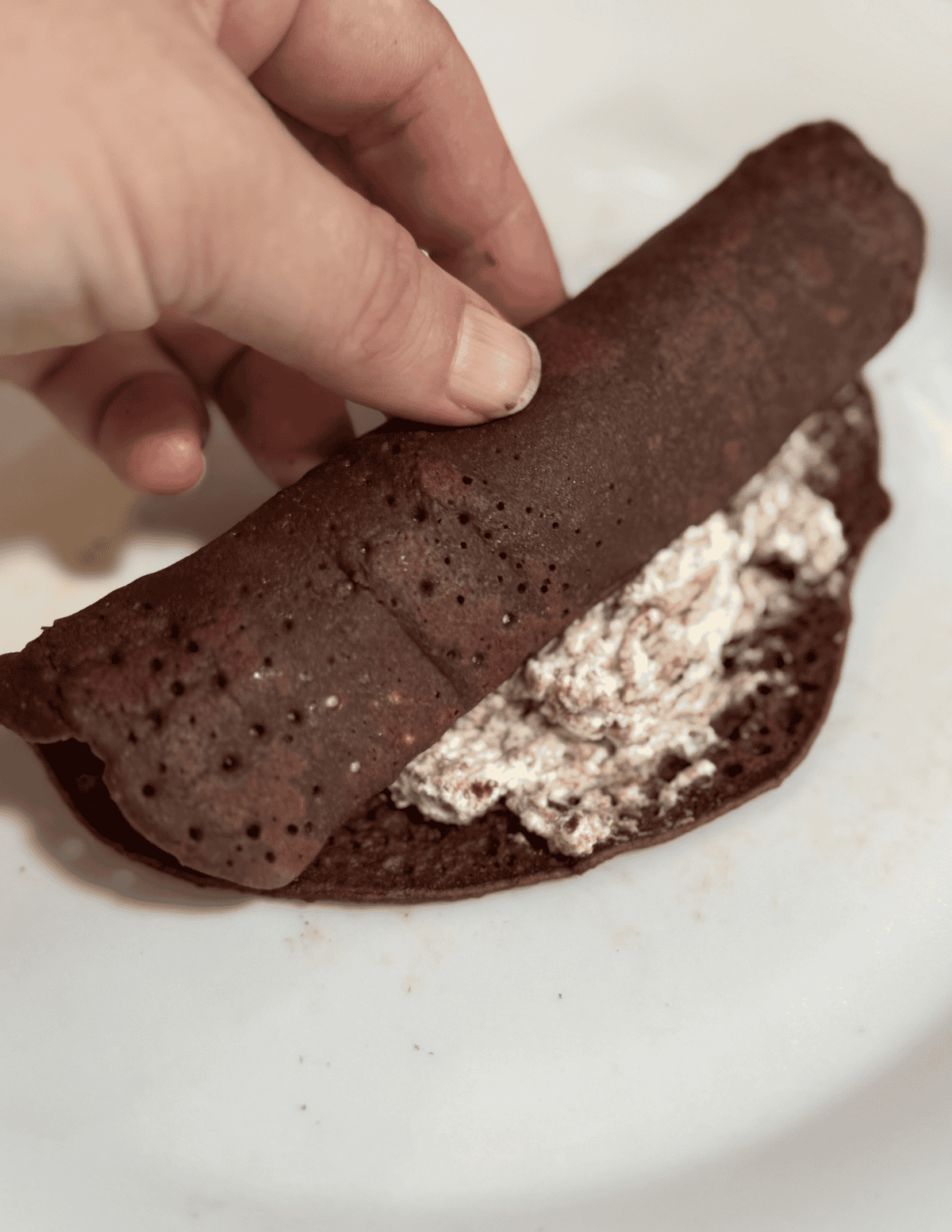 Freshly made chocolate roll with creamy filling, perfect for dessert.