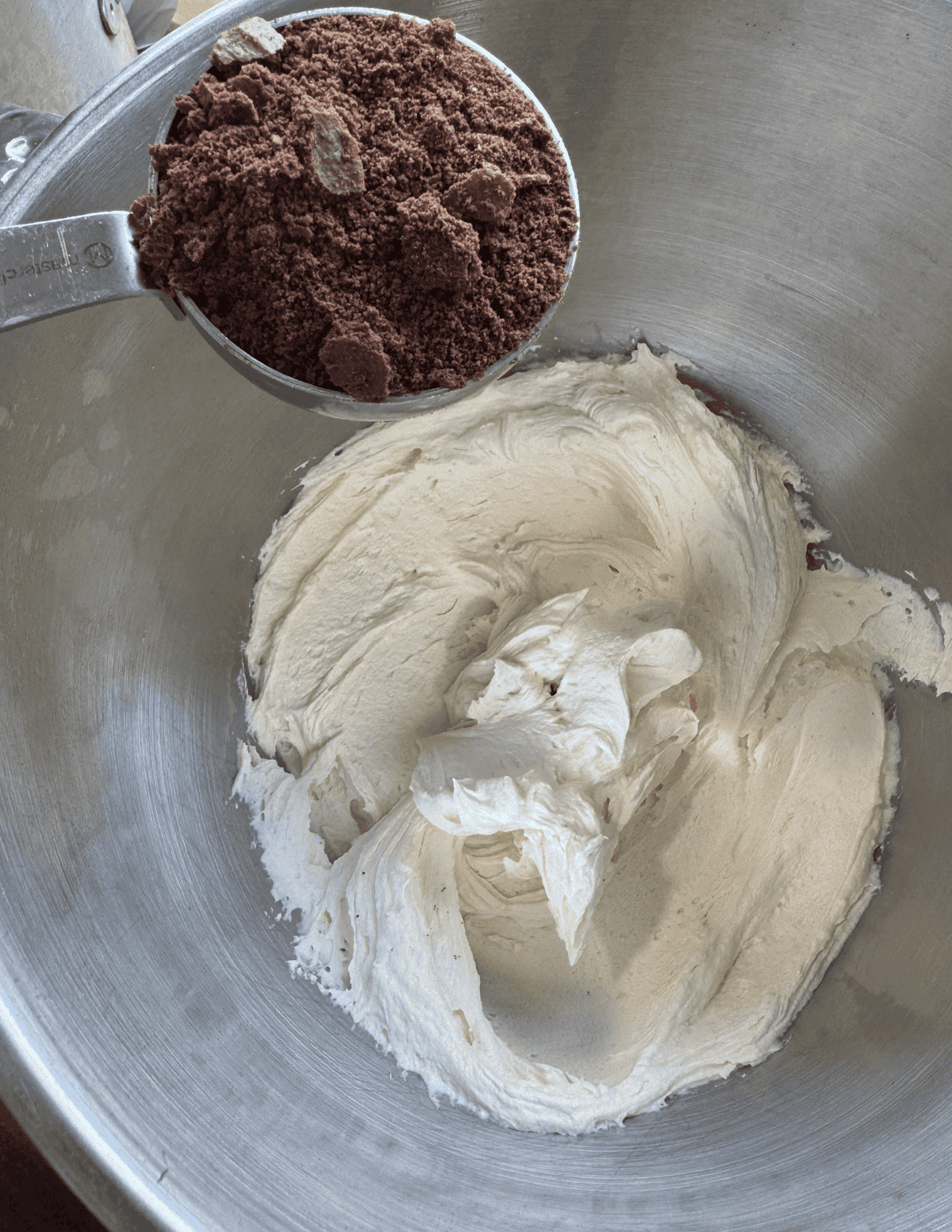 Freshly mixed cream cheese and cocoa powder in a baking bowl.
