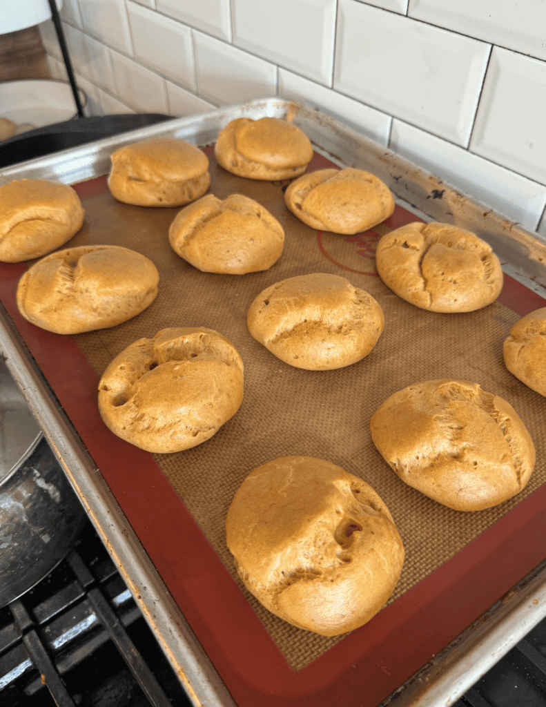 Baked bread rolls fresh from Farm Fresh Family, showcasing homemade quality and farm-to-table freshn.