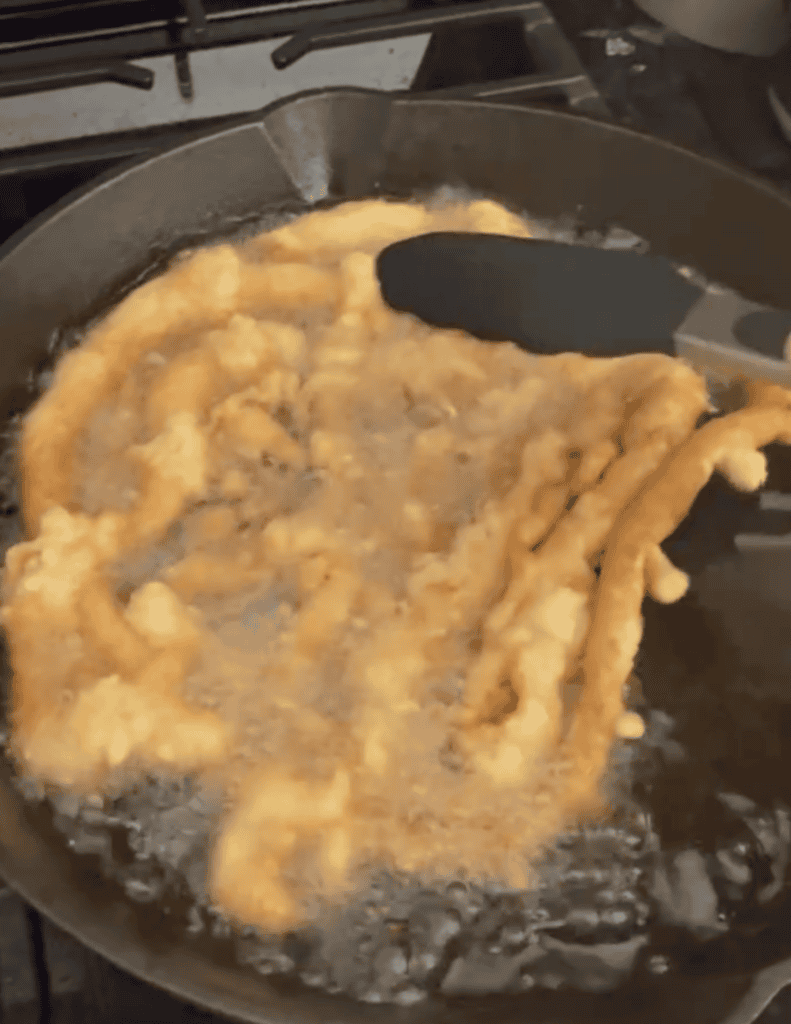 flipping funnel cake