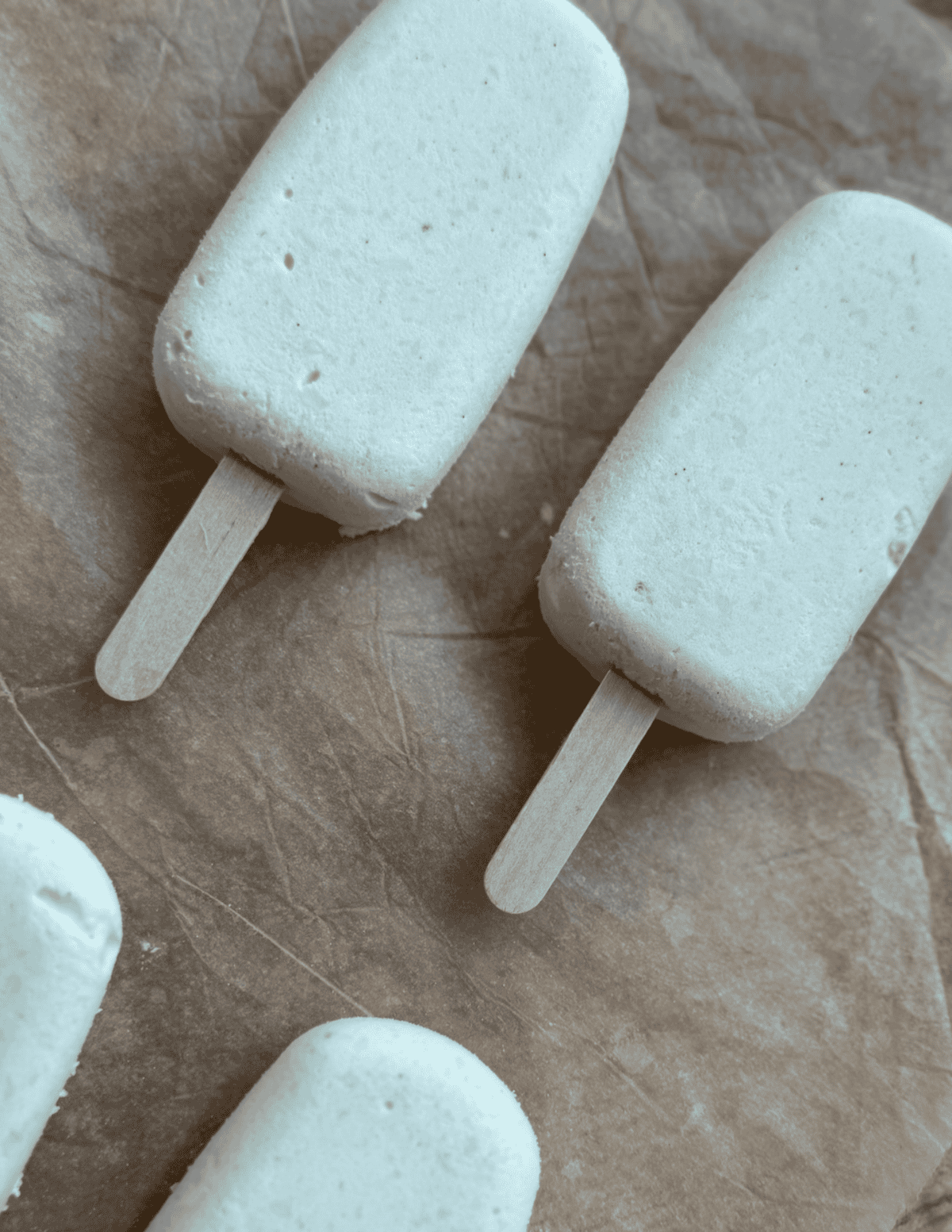 Ice cream bars on wooden sticks, fresh and creamy.