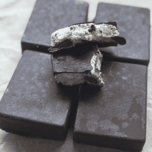 Delicious homemade chocolate cookie bars with creamy filling and chocolate coating.