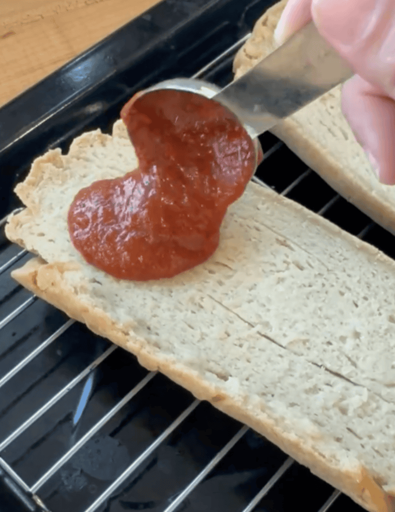 Fresh homemade bread topped with rich tomato sauce.