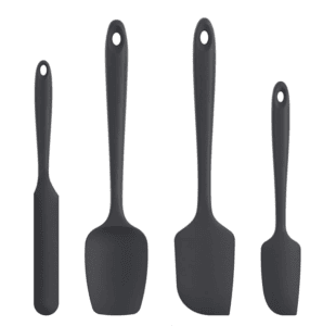 Set of four black silicone spatulas for cooking and baking.