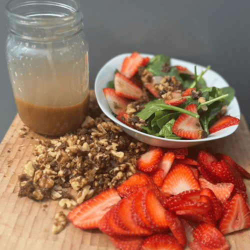 strawberry salad on wooden cutting board