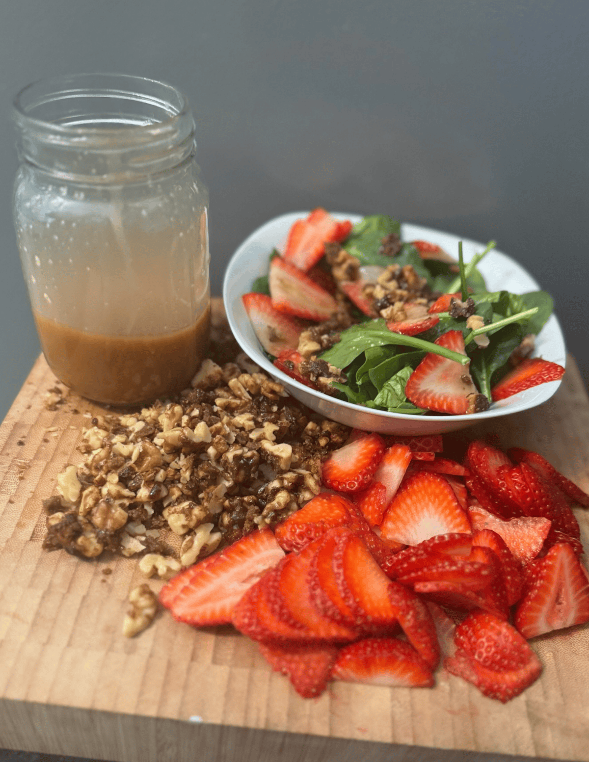 strawberry salad on wooden cutting board