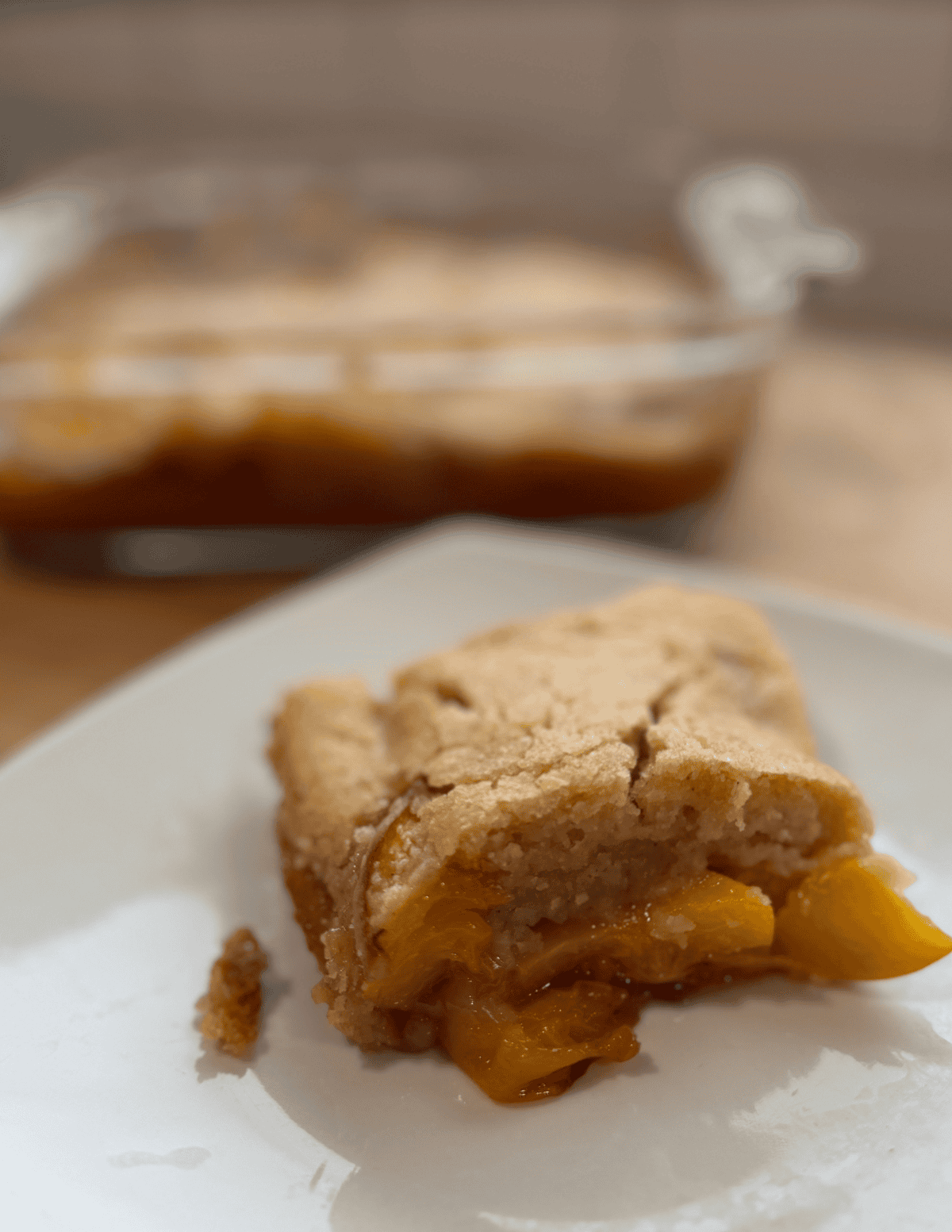 Peach cobbler with fresh, ripe peaches and golden crust, perfect for family desserts.