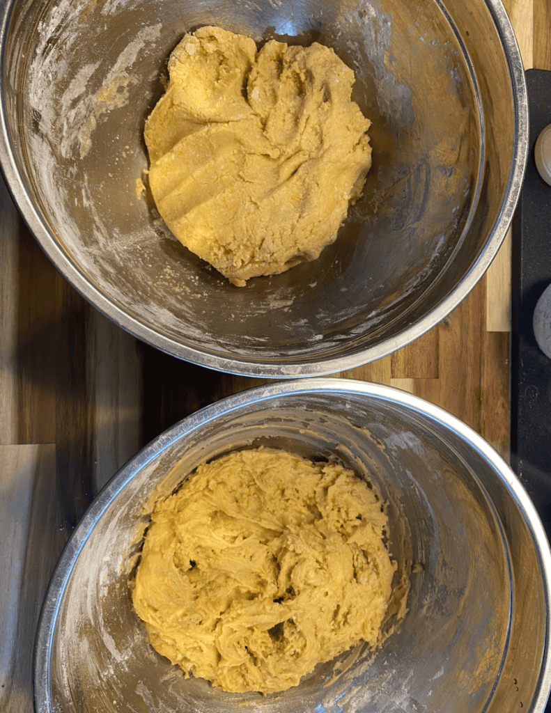 Cookie dough mixture in mixing bowls for gluten-free ice cream nachos.